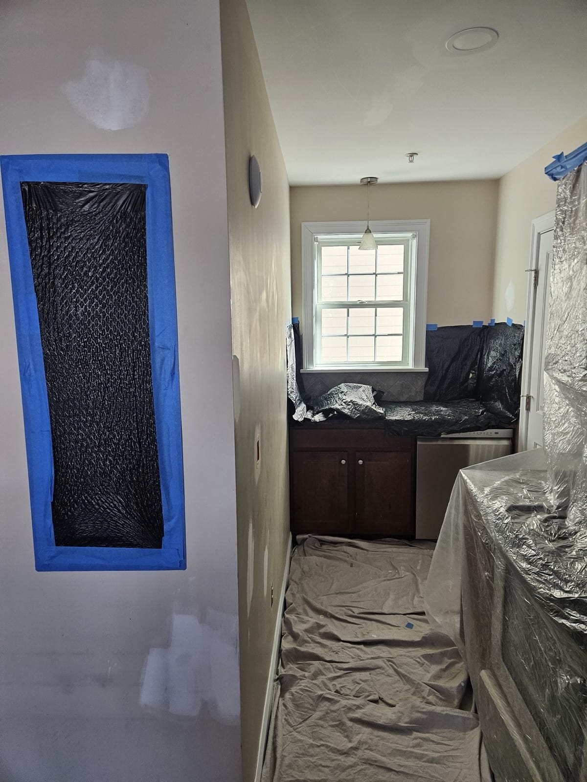 Paint preparation work, patching and priming walls before painting